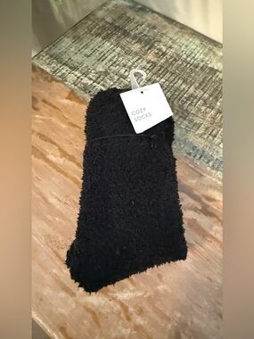 One pair of Soft Cozy Fuzzy black socks. New with tag.
